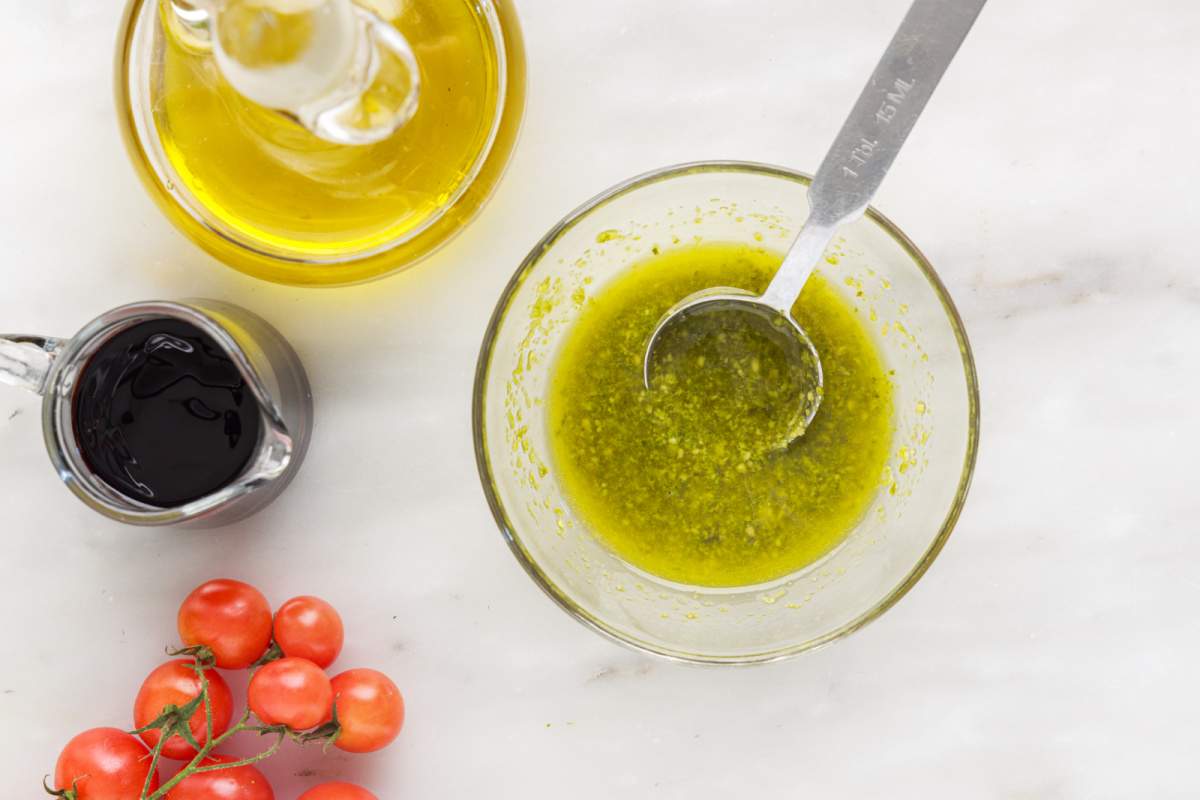 pesto mixture being mixed in a small bowl