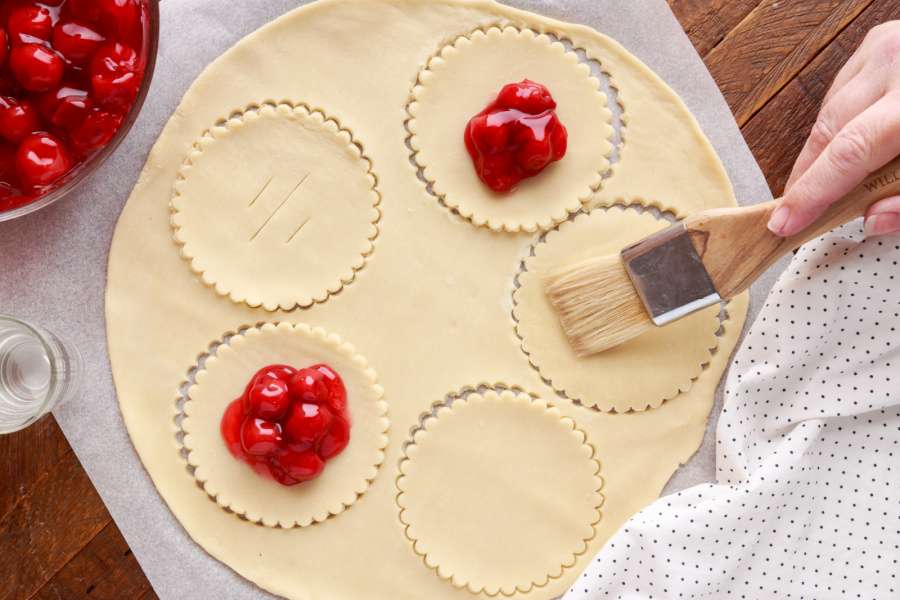 brushing water on top of crust