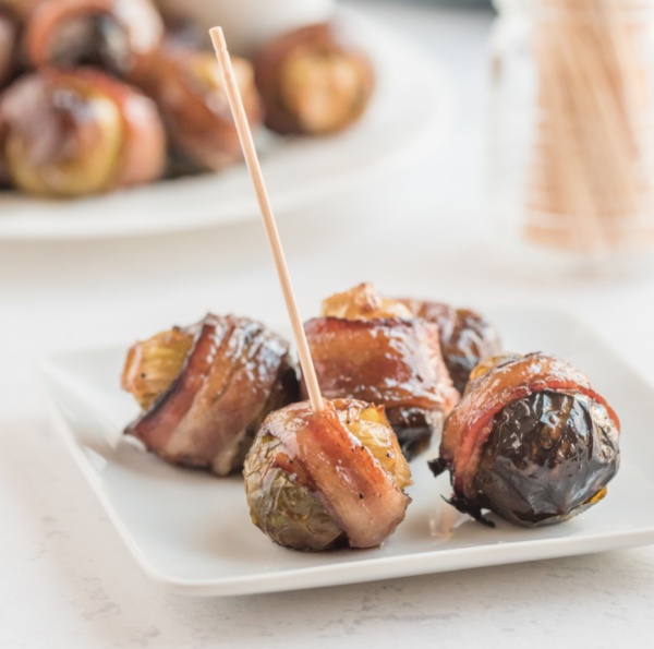 bacon wrapped brussels sprouts on a plate