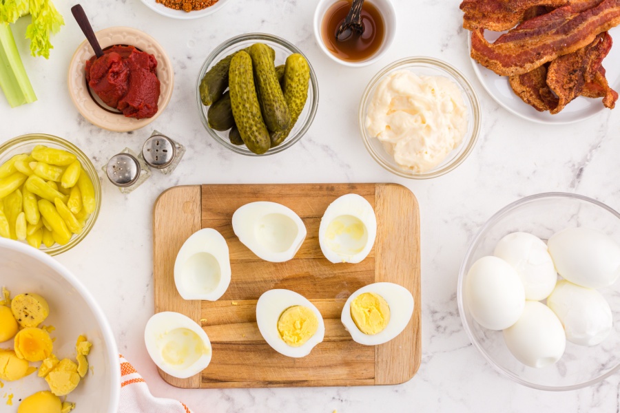 hard boiled eggs cut in half on cutting board