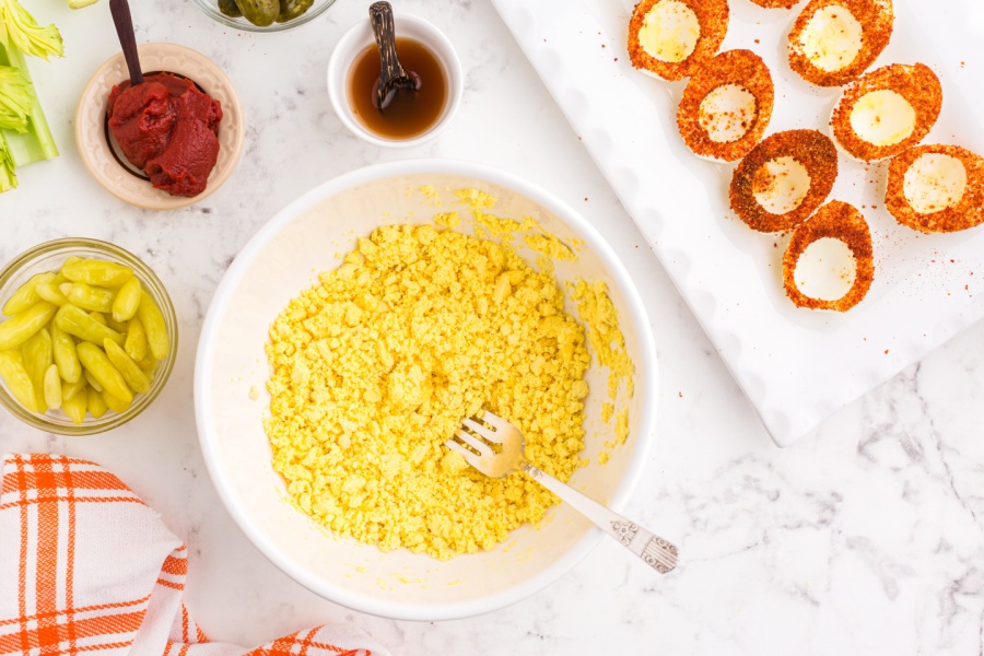 egg yolks mashed in a bowl