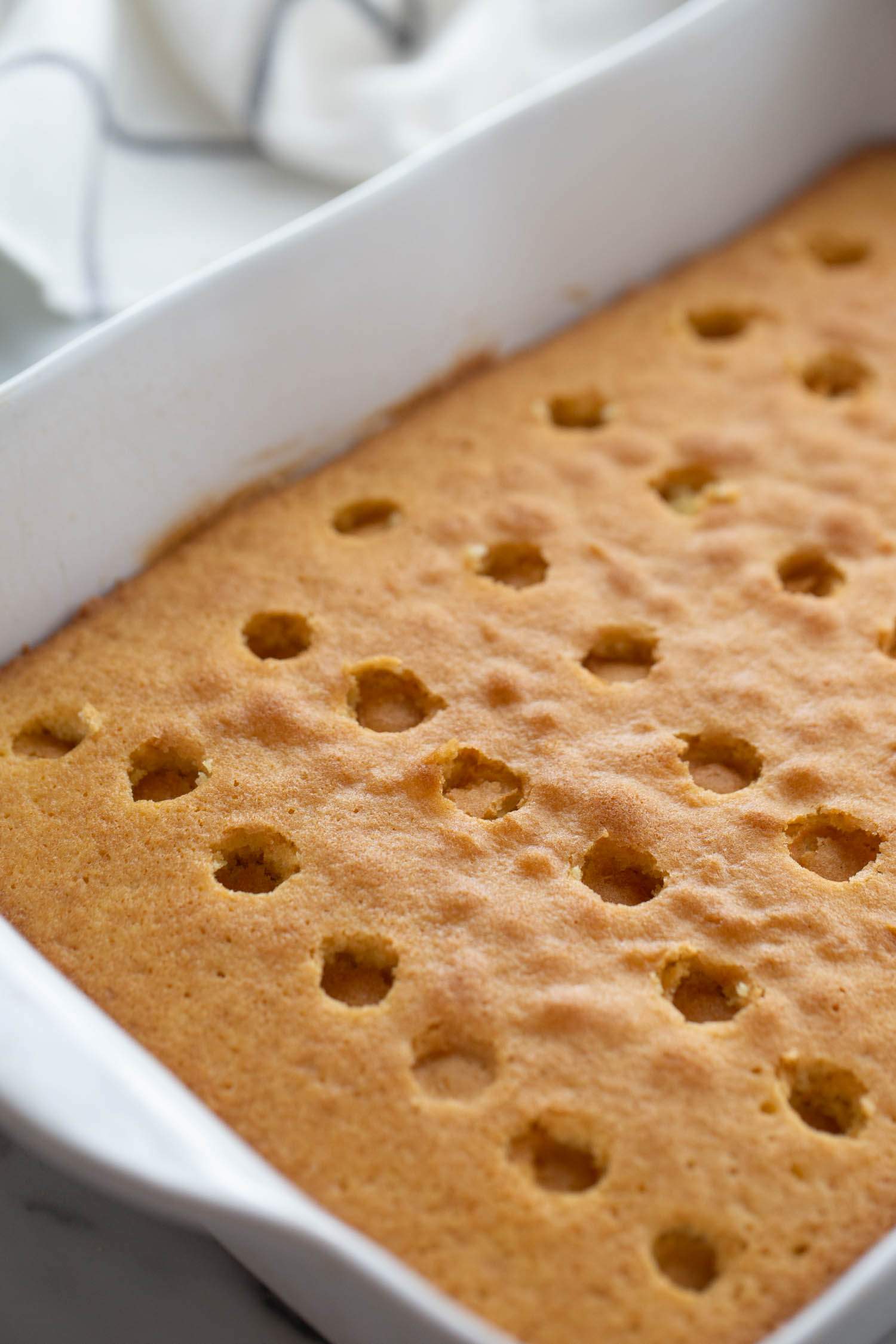 holes poked into cake