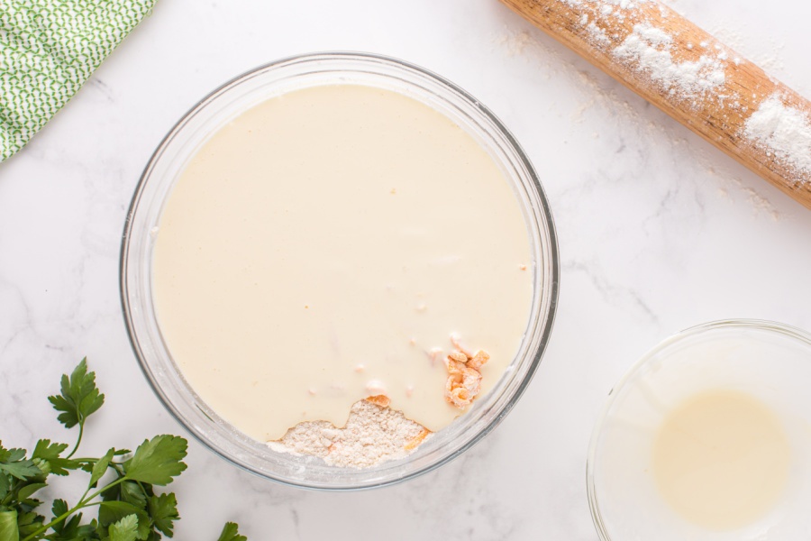 adding wet ingredients to dry ingredients