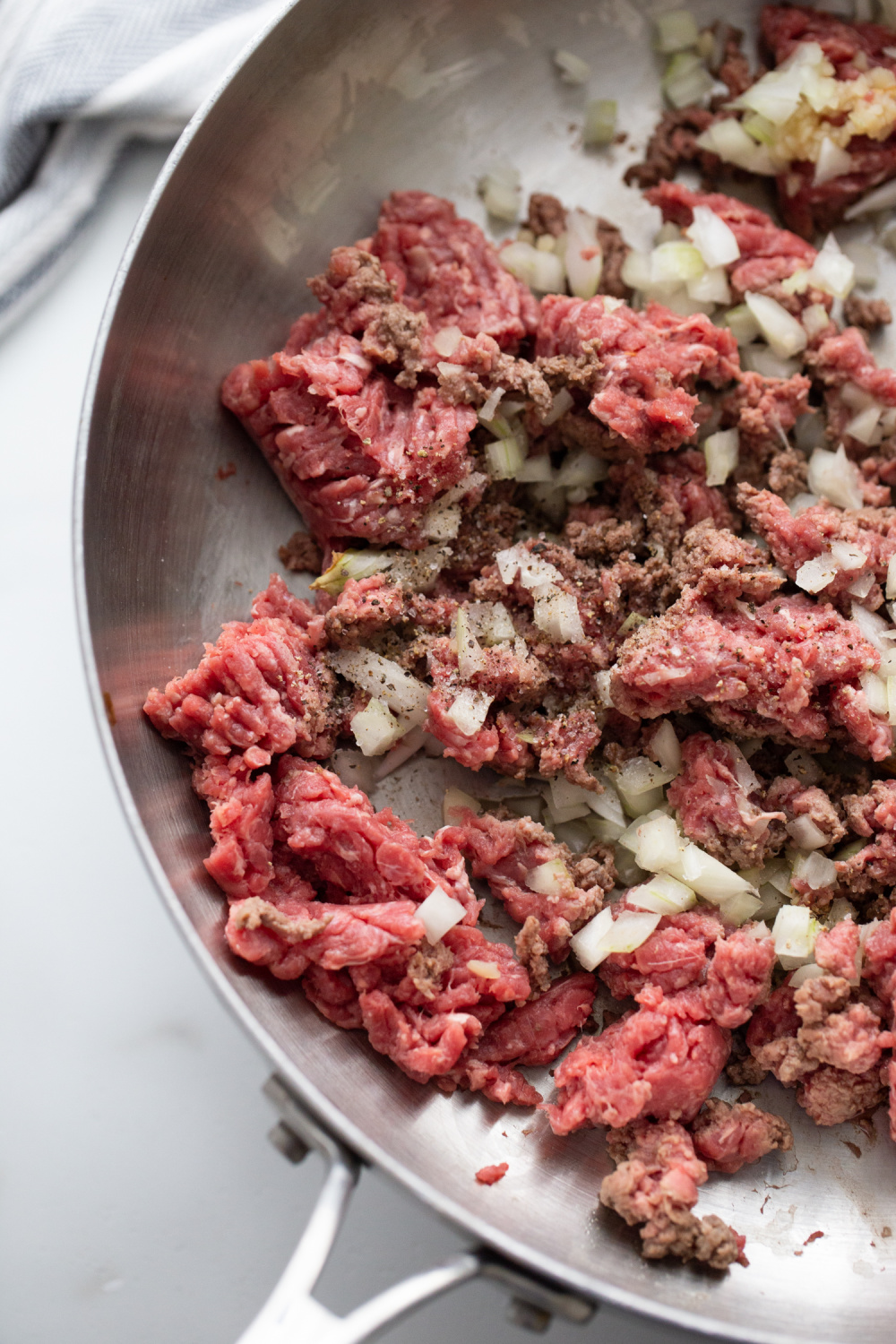 ground beef and onions in a pan