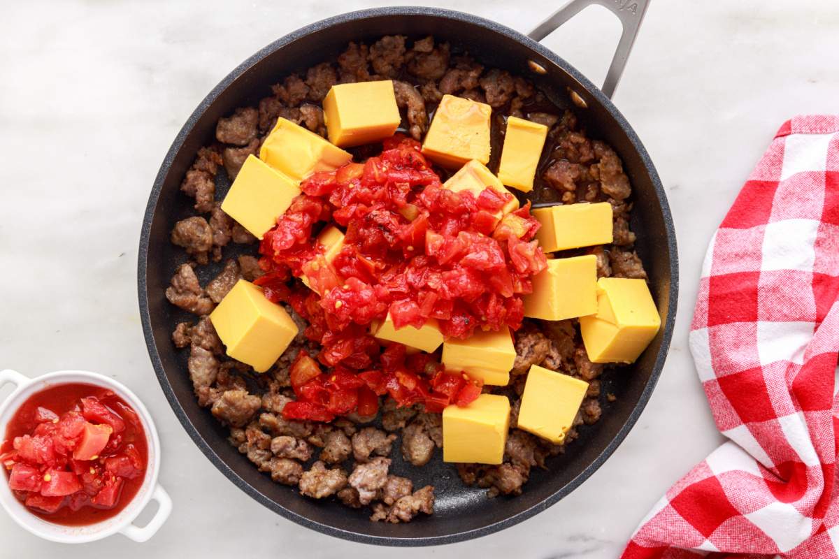 cheese and tomatoes added to pan