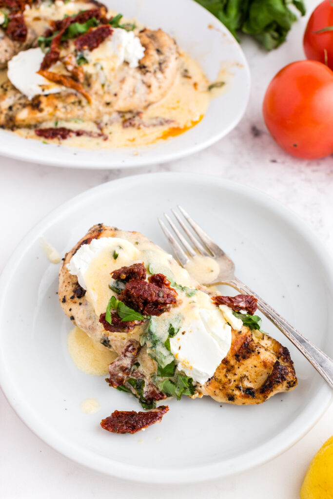 A serving of Copycat Carrabbas Chicken Bryan on a plate