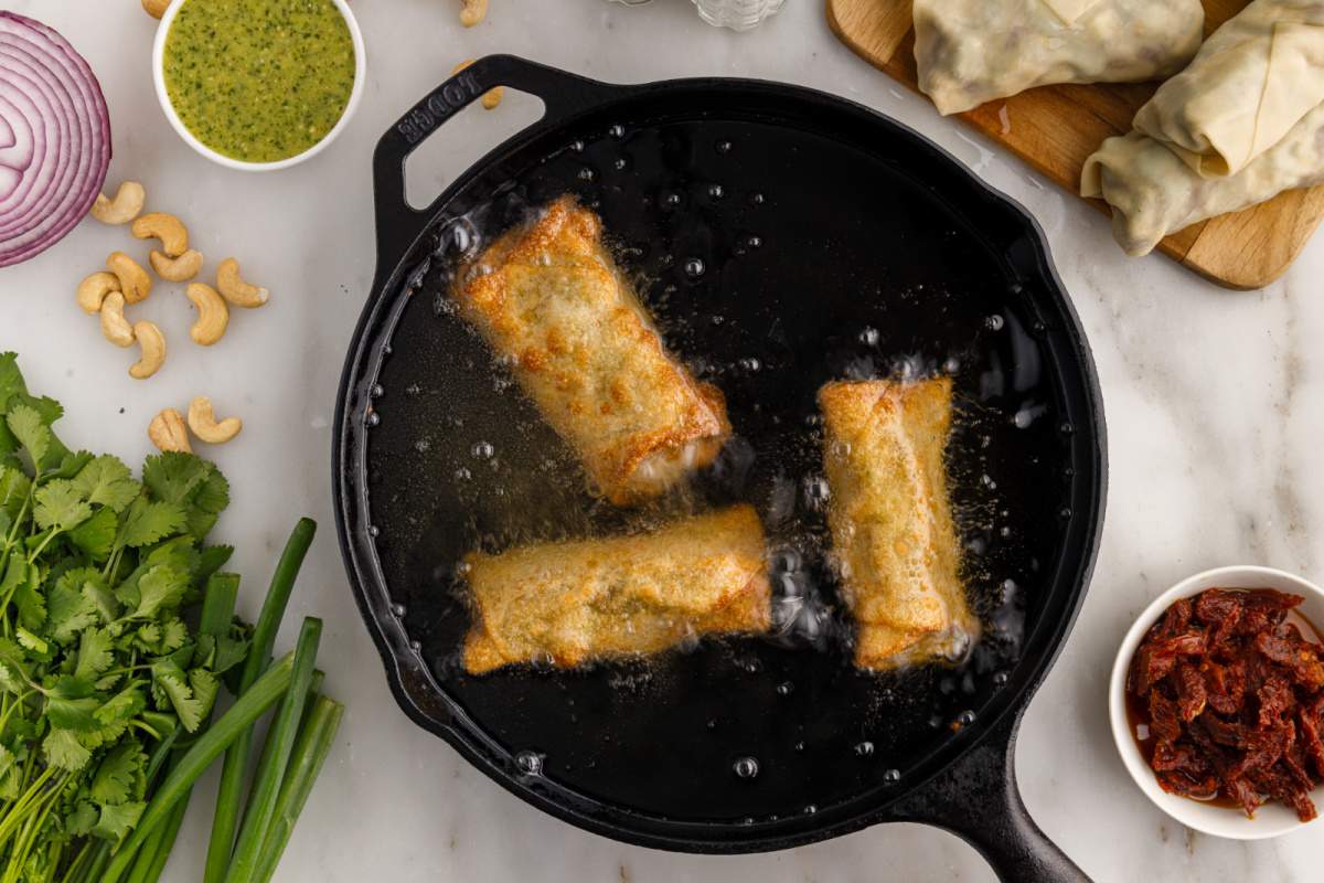 3 avocado eggs rolls frying in pan