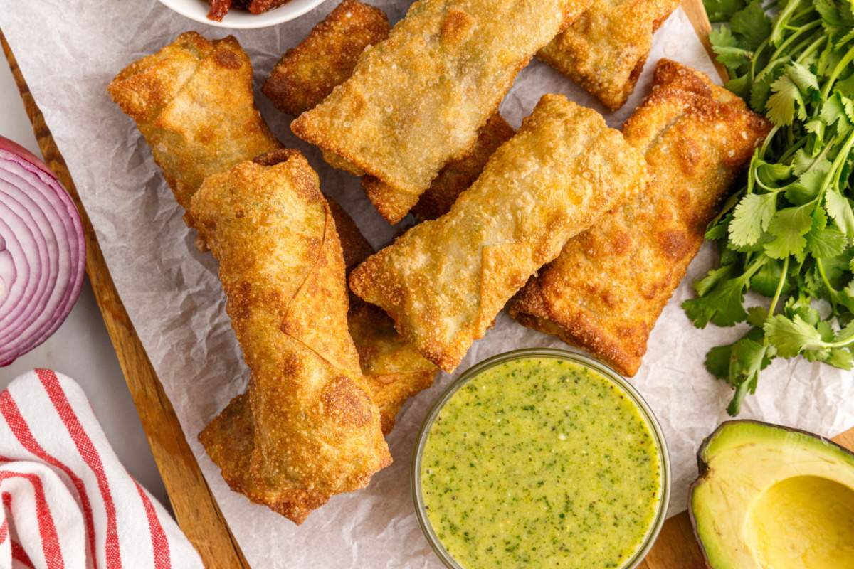 Copycat Cheesecake Factory Avocado Egg Rolls on a plate with dipping sauce