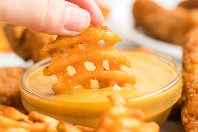 Copycat Chick Fil A Sauce - Dipping waffle fry in sauce - Family Fresh Meals