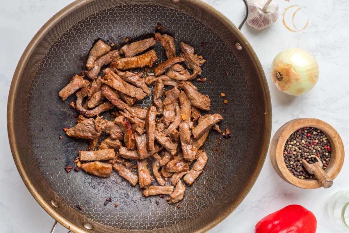 cooked beef strips in a pan