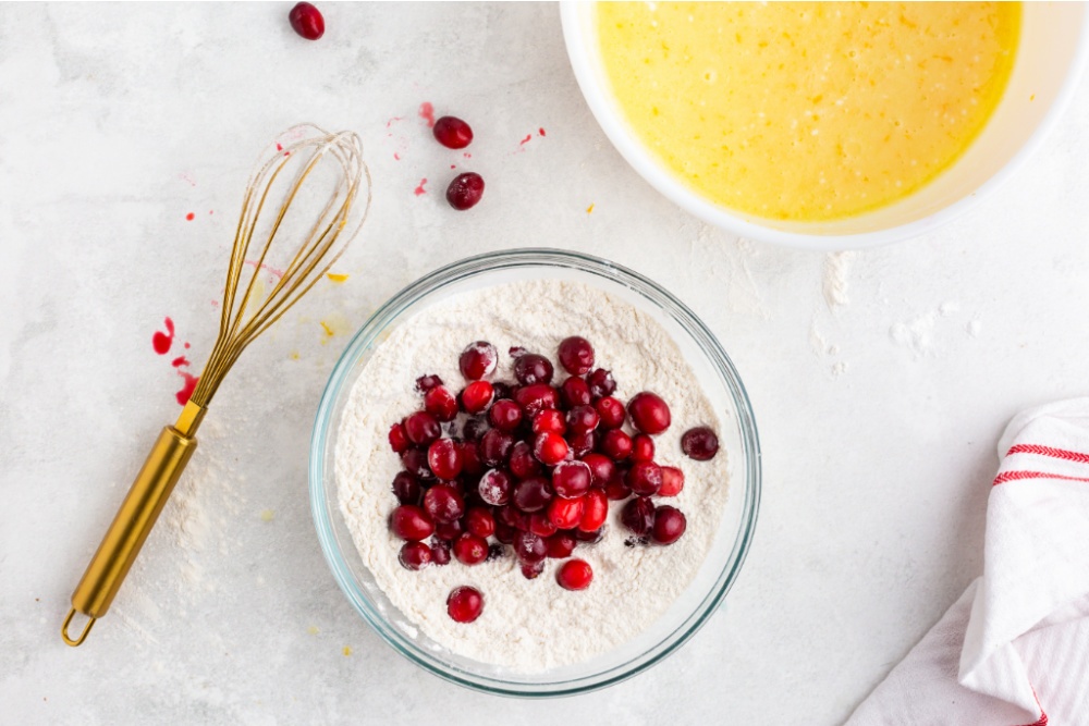 cranberries being added to flour mixture