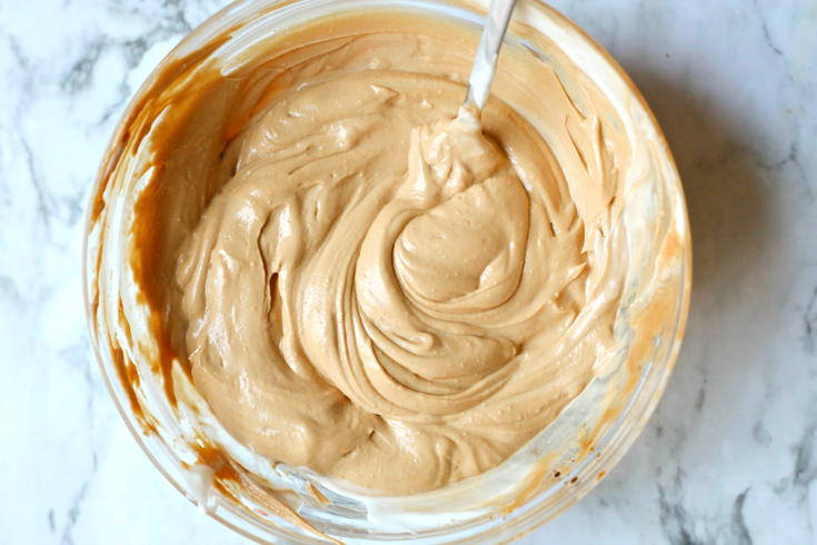 Creamy Thai Chicken Salad - creamy peanut butter sauce mixed in a glass bowl