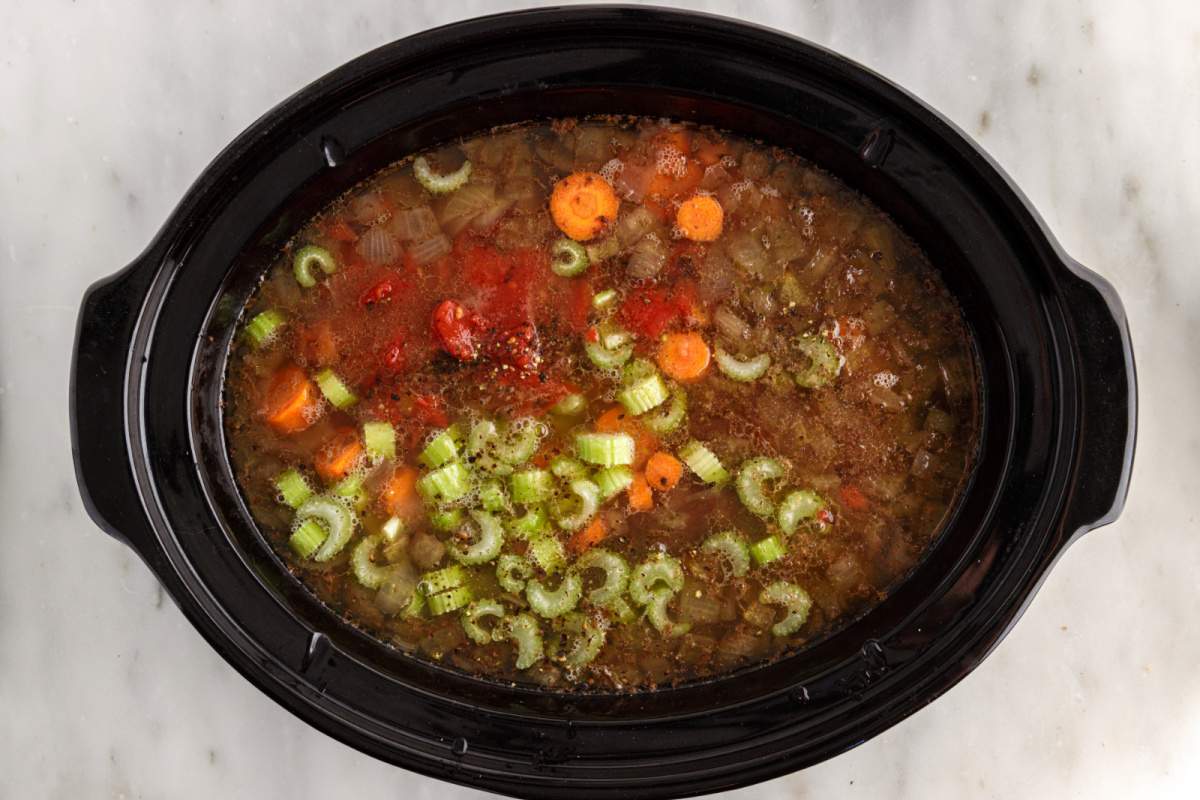 carrots, celery, diced tomatoes (including juices), and pepper added to slow cooker