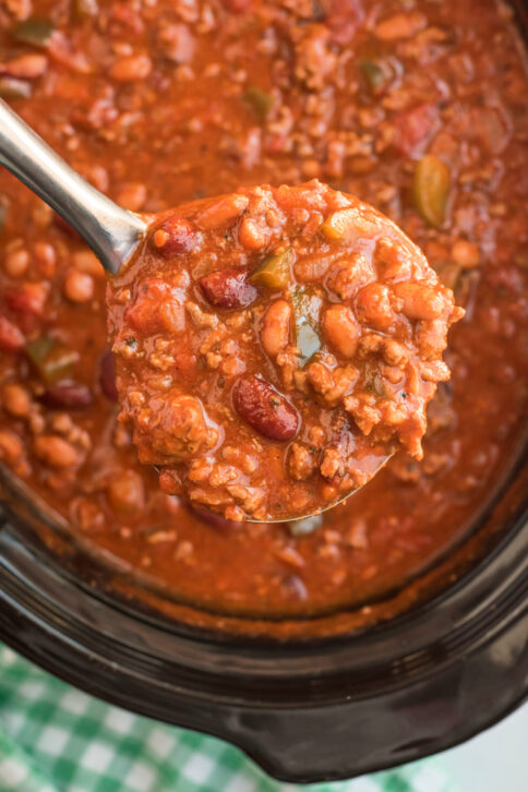 A ladle scooping up some Crockpot Chili Con Carne