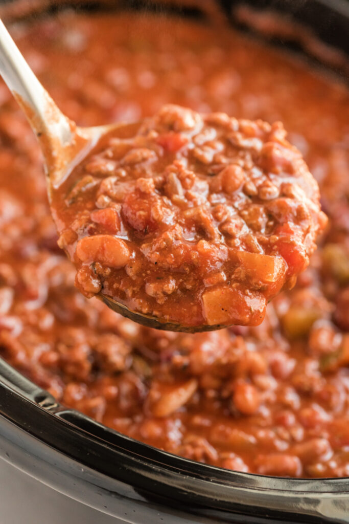 A ladle scooping up some Crockpot Chili Con Carne