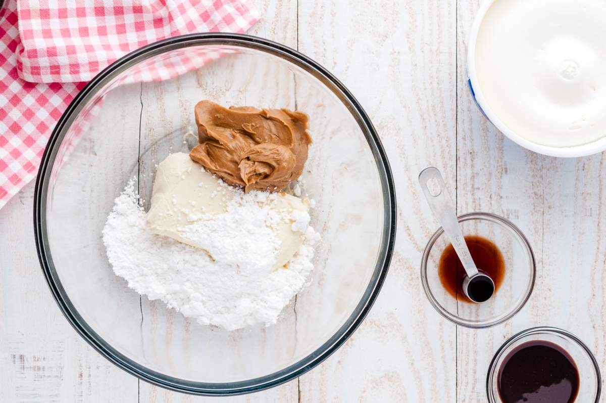 cream cheese, peanut butter and powdered sugar and vanilla in a bowl