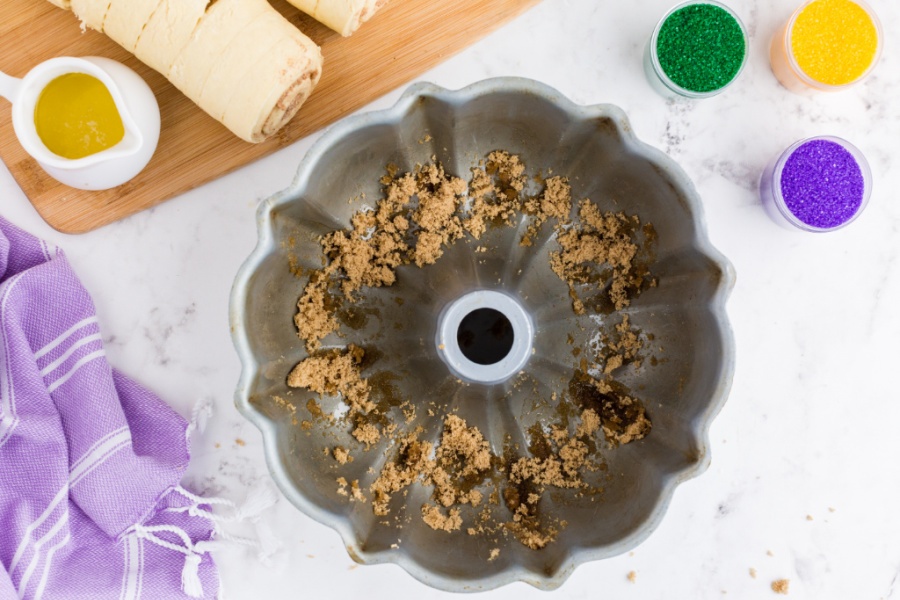 melted butter and brown sugar in the bottom of a bundt cake