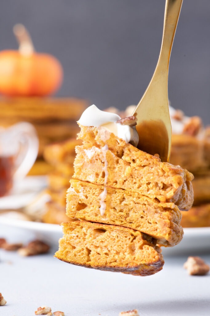 Fluffy Pumpkin Pancakes picked up with a fork