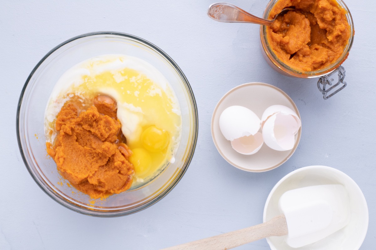 pumpkin, egg and butter added to bowl