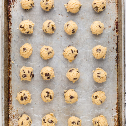 Cookie dough balls on a baking sheet