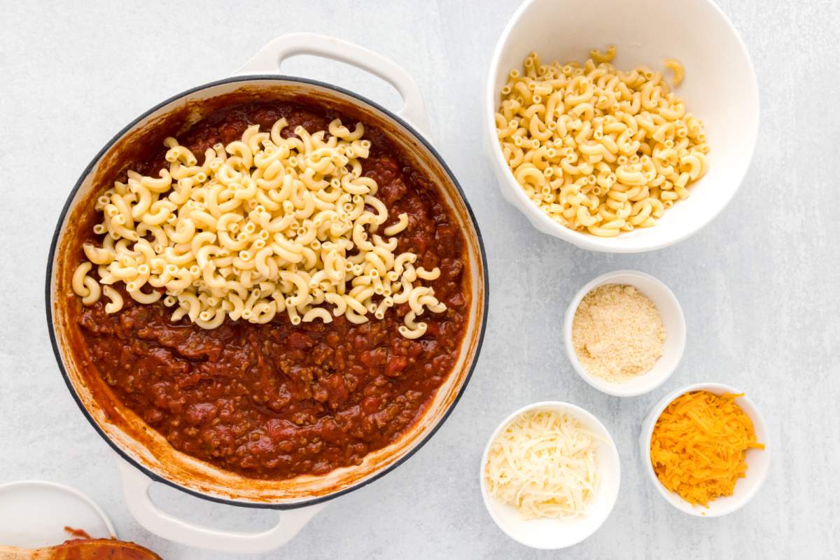 adding pasta to pot