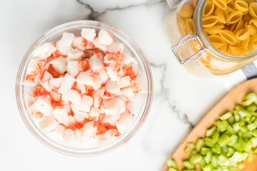 Homestyle Seafood Pasta Salad Ingredients crab celery and noodles in bowls