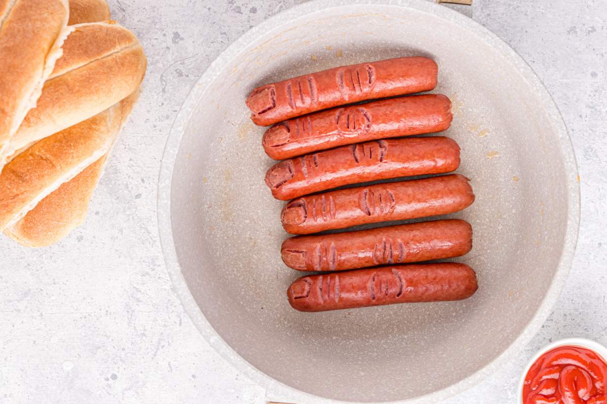 hotdogs in pan