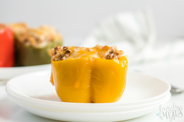 Instant Pot Stuffed Peppers - Yellow stuffed pepper served on a white plate