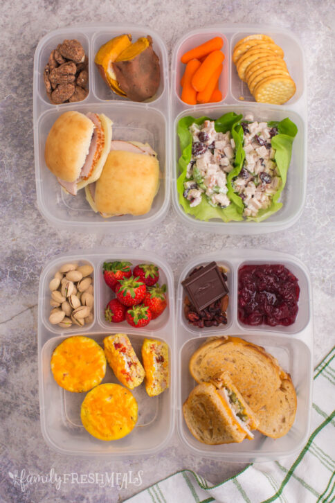 top down image of 4 lunchboxes packed with Thanksgiving leftovers