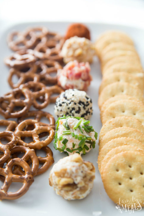 Mini Cheese Balls Recipe served on a white plate with crackers and pretzels