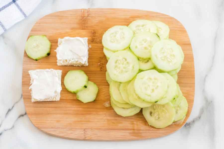 showing how to make mini cucumber sandwiches