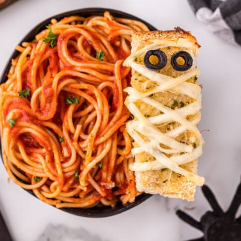 Mummy garlic bread in a bowl of spaghetti