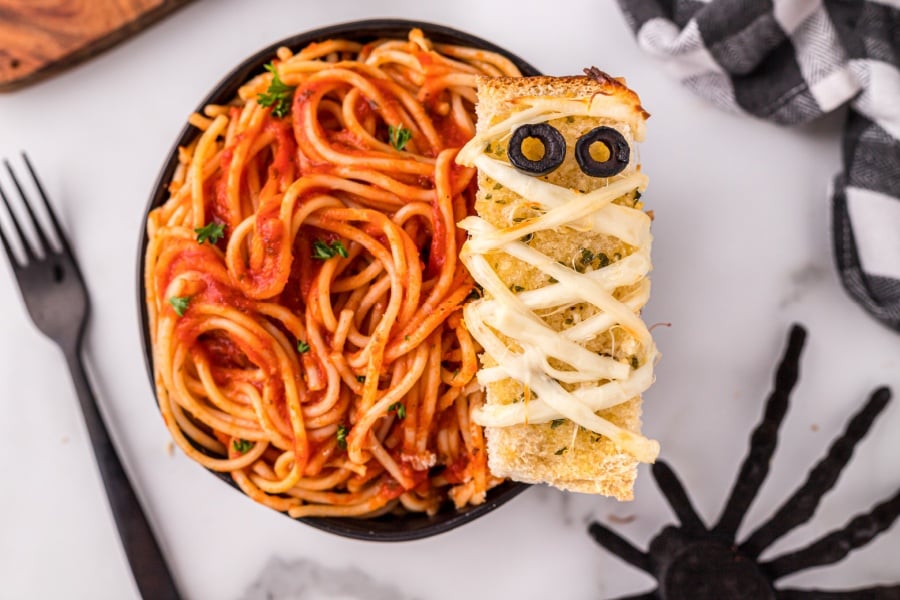 Mummy garlic bread in a bowl of spaghetti