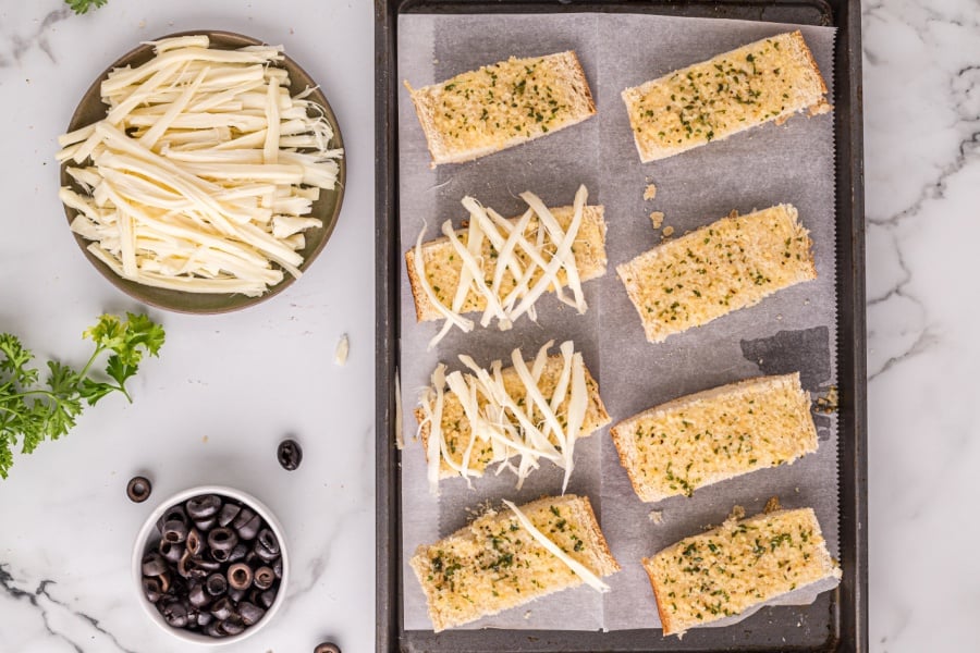 placing cheese slices on bread slices