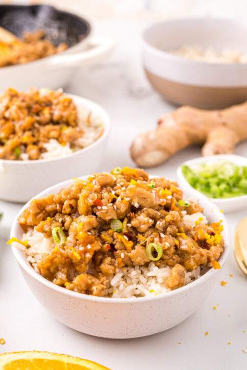 Orange Ground Chicken in bowl with rice