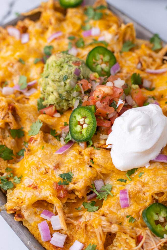 Slow Cooker Chicken Nachos on a baking sheet