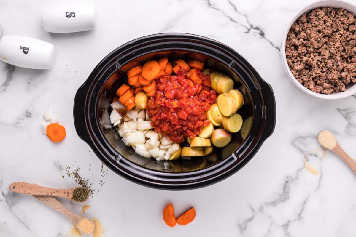 sliced carrots, diced potatoes, diced onions, Italian diced tomatoes added to slow cooker