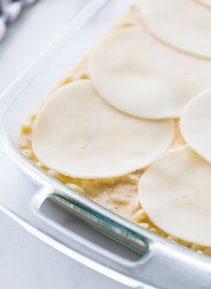 sliced cheese placed on top of casserole